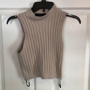 Knitted crop/ halter top with a mock turtle neck